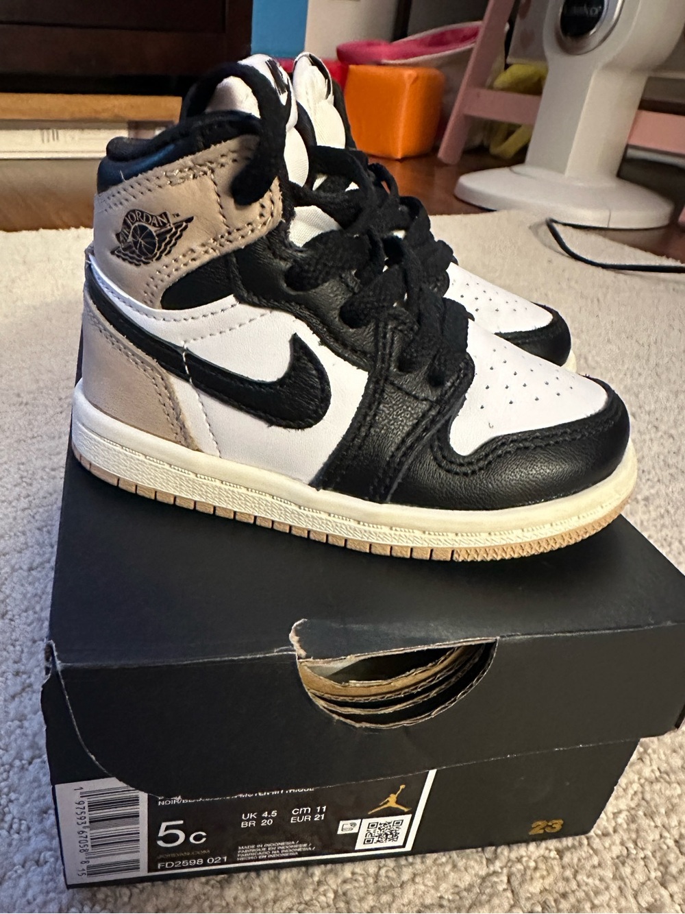 Jordan Kids Black White and Tan High-Top Sneakers